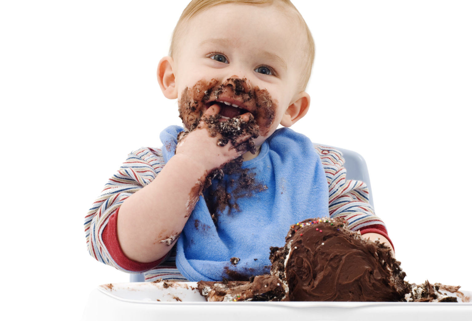 A messy baby eating his chocolate cake - ODEA Marketing